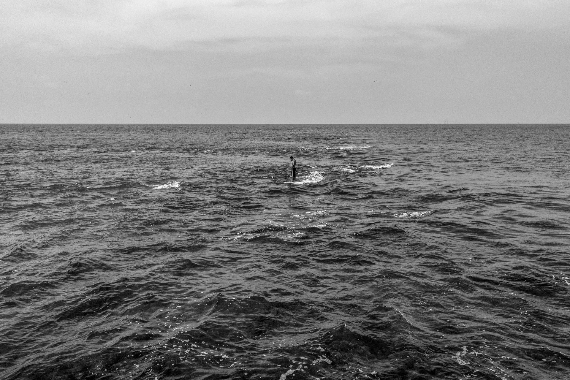 <p>A man stands on the remains of a breakwater in Sánchez Magallanes, Tabasco, Mexico. Coastal erosion in Tabasco has consumed over 500 meters of land since 2005, fueled by increasingly frequent winter storms.</p>
